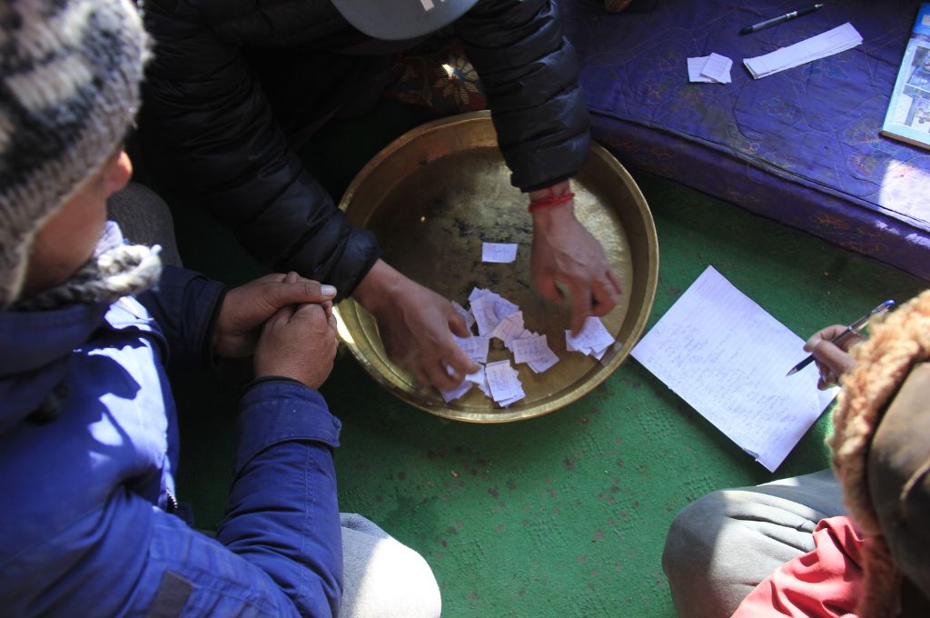 Chits with names of one member from each house in the Kibber village on a brass plate-Kibber panchayat election