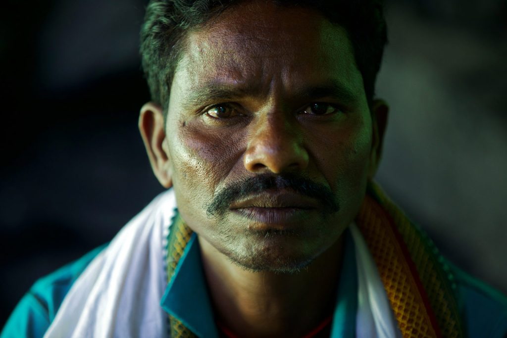 A close-up of a man looking at the camera_coal mining