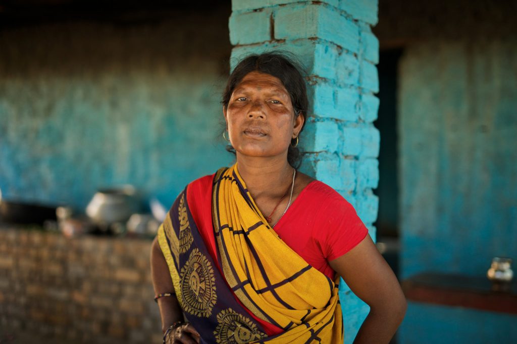 A photo of a woman leaning against a pillar_coal mining