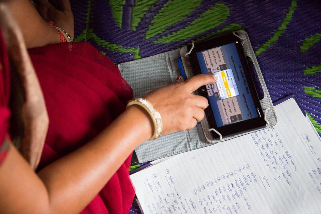 A woman using an app on a digital tablet-digital rights and privacy