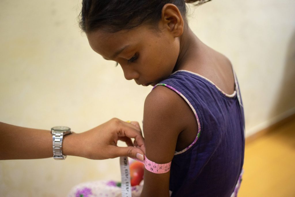 child getting measured for malnutrition_food insecurity