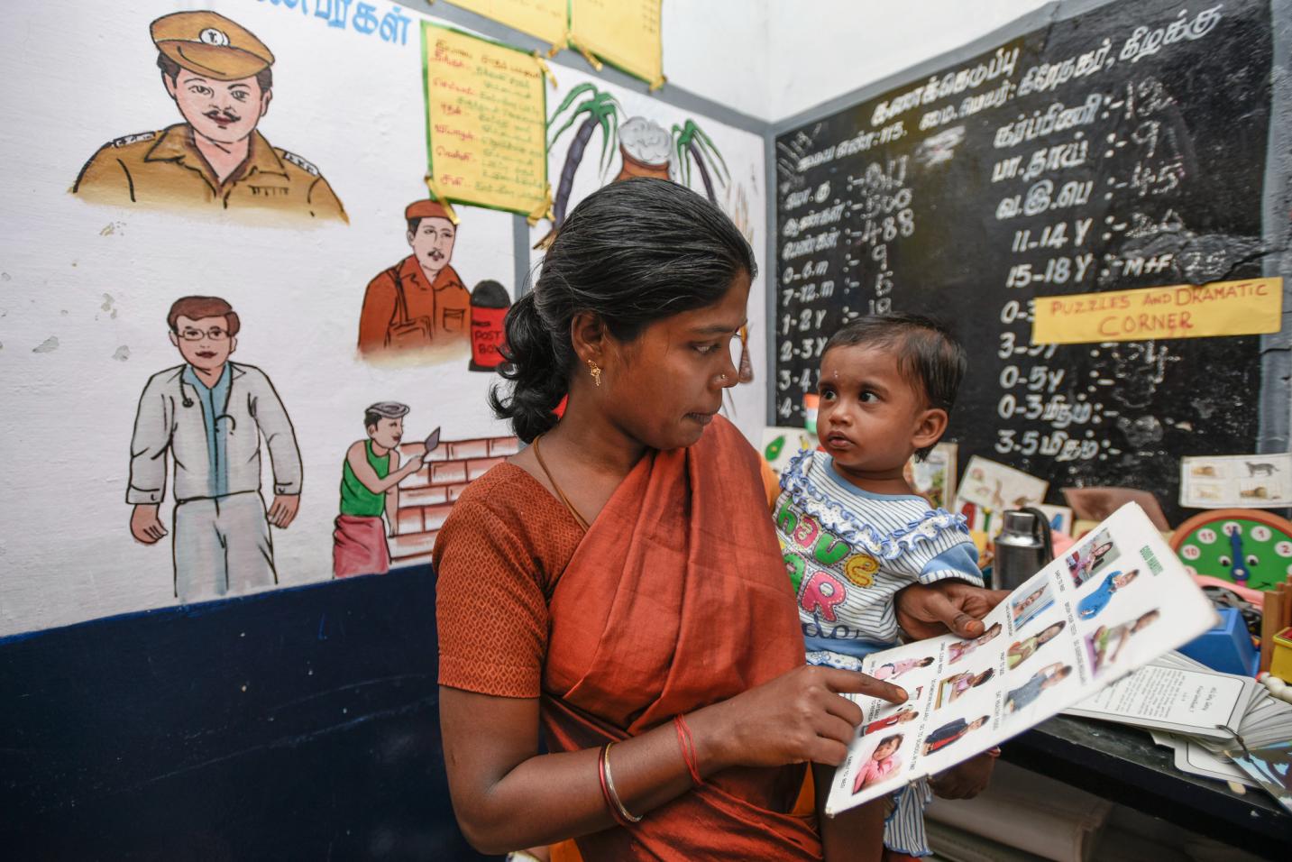 woman teaching a small child in a classroom_early childhood education