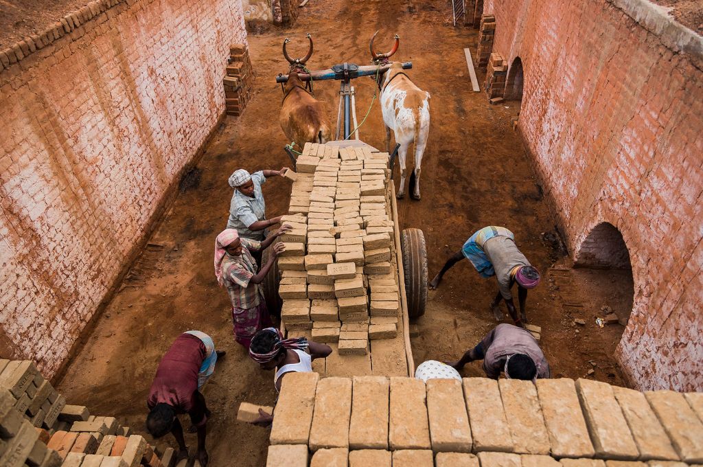 men loading bricks on a cart-mgnrega