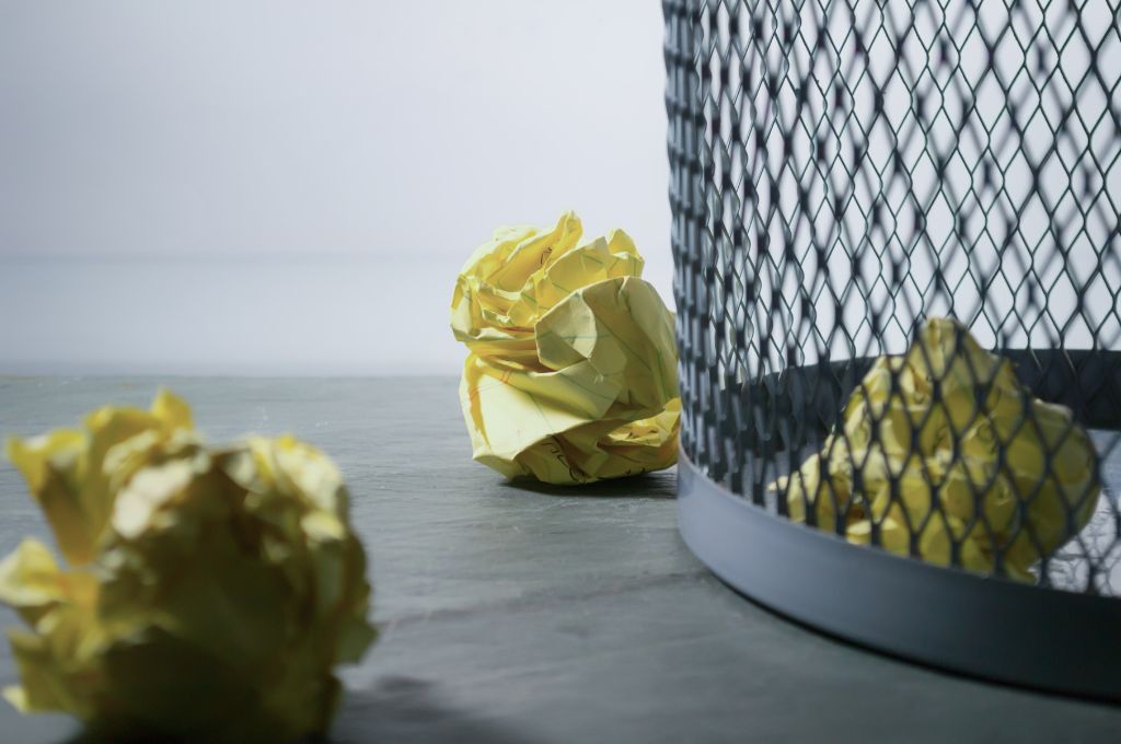 Trashcan with rolled paper inside and around it_nonprofit donor