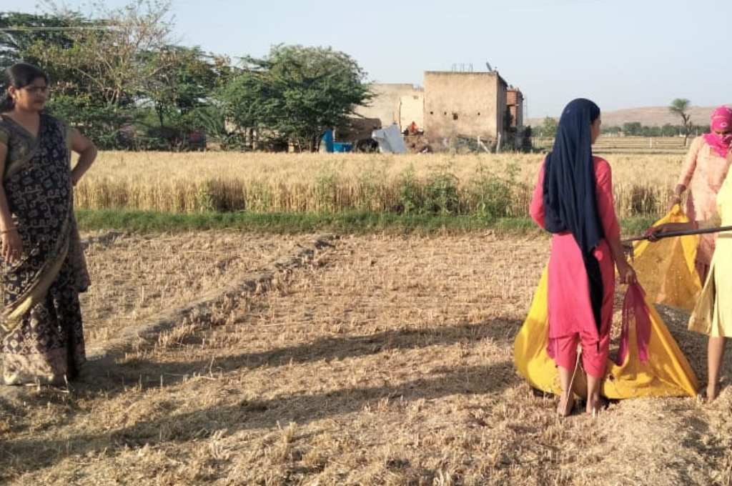 A group of women standing in a field--newly married women