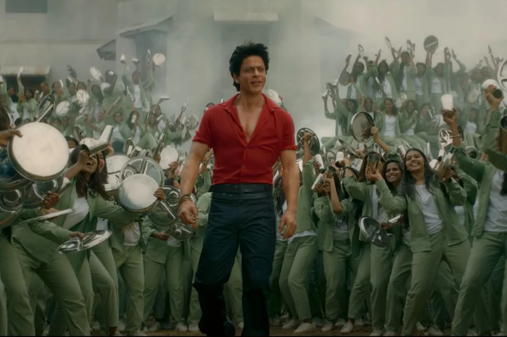 Bare-chested SRK sauntering through a group of women-Jawan