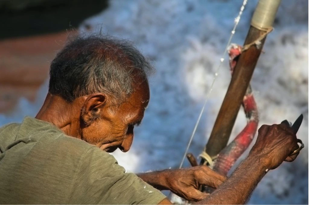an old man making a tool_bhil community