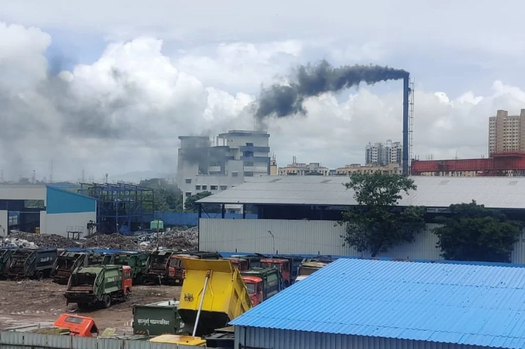 A dumping ground and a chimney with smoke_citizen