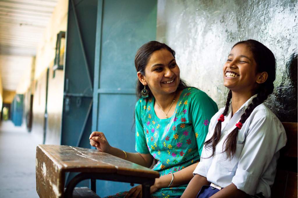 teacher laughing with student-education