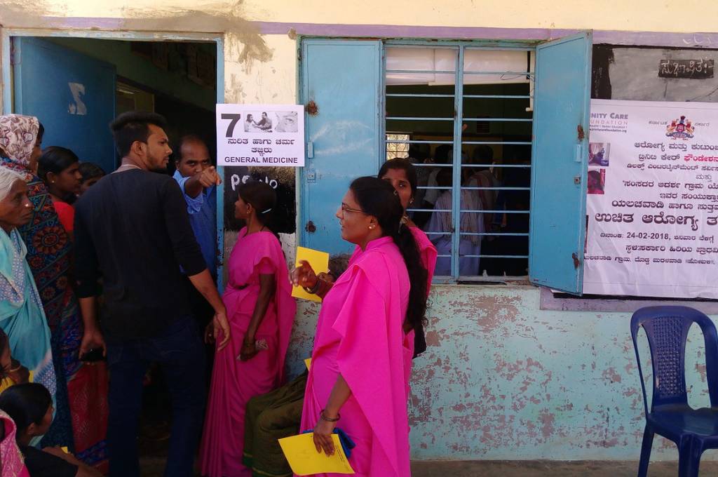 people standing in line to receive healthcare-public healthcare