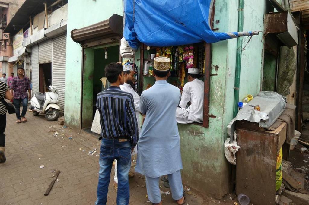 two men standing in an urban colony-active citizens