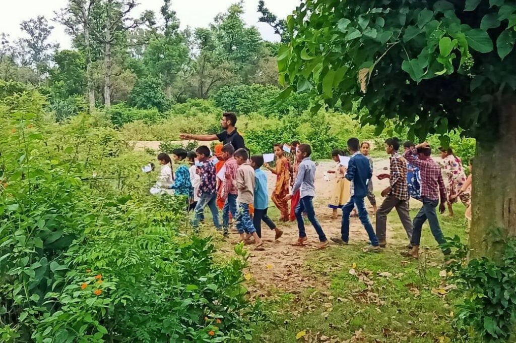 man walking with children in a forest_vann gujjars