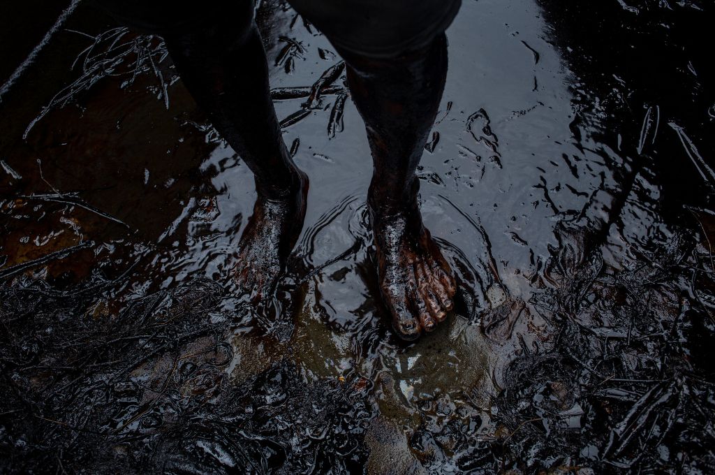 feet in a river polluted by oil. After the oil leak, the Kosasthalaiyar river was primarily cleaned up by fishermen without any safety measures. The toxic chemicals in the oil severely affected their skin_industrialisation