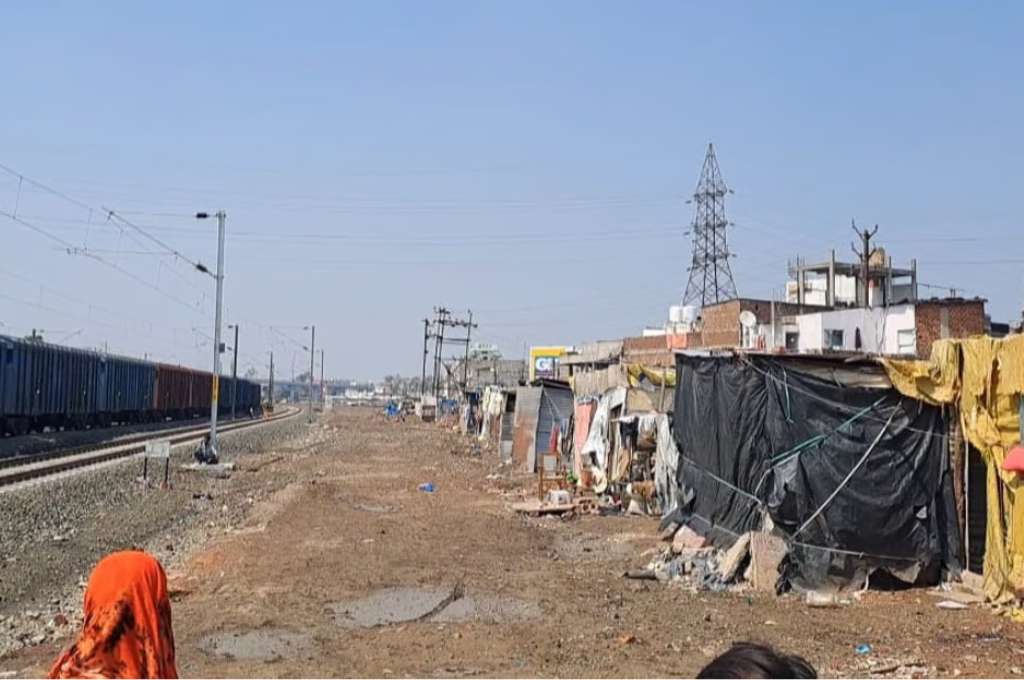 informal settlements and shanties next to a railway line-bhopal