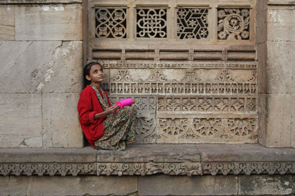 A young girl staring up at the sky-programme