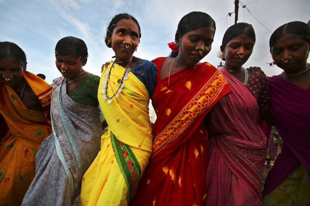 six women in saris dancing-renewable energy