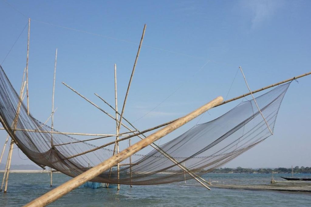 a large fishing net, also known as a chinese fishing net--Life of the Kaibarta fishing community in Assam