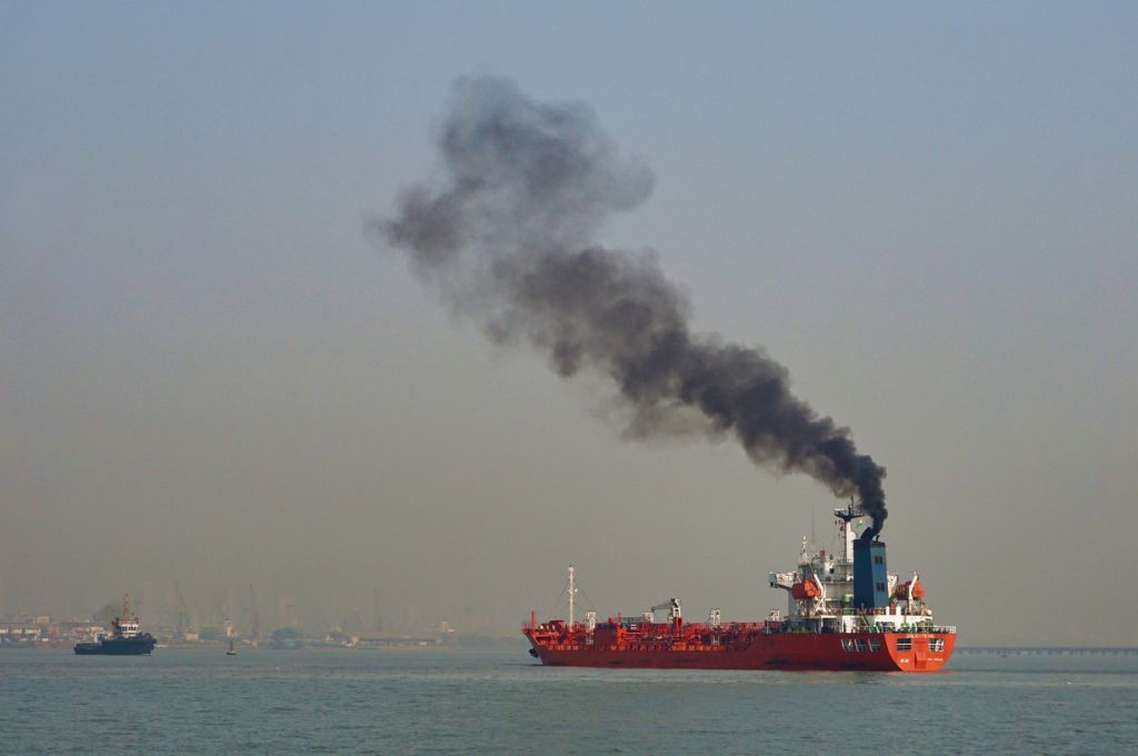 A ship in the sea emitting smoke_air pollution