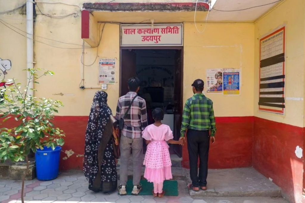 A family standing in front of a foster care centre_foster care