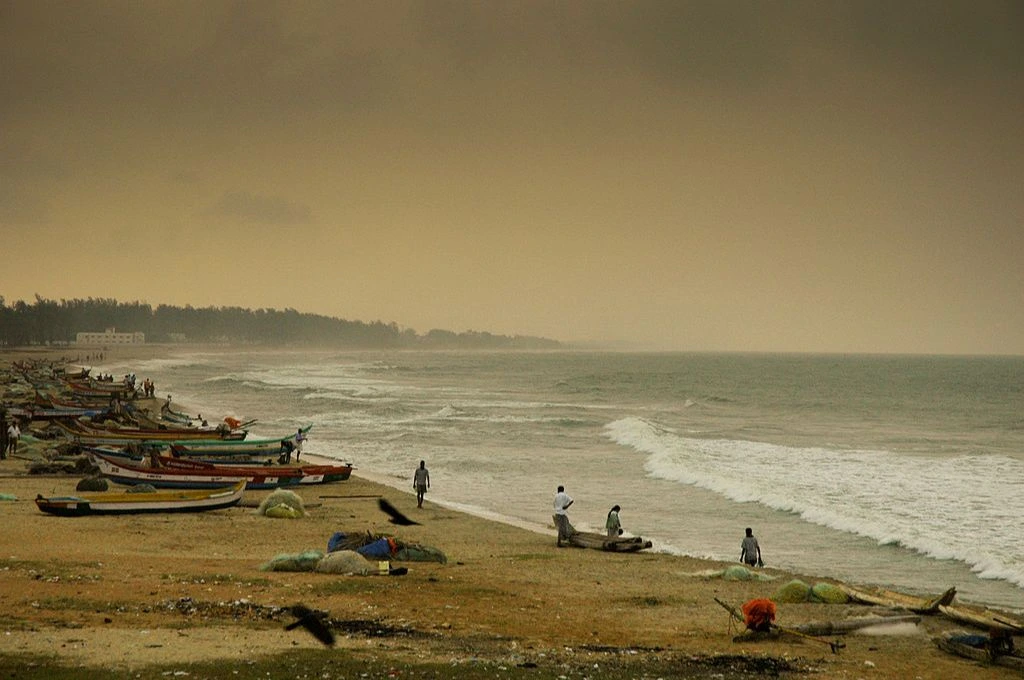 A sea shoreline with people and boats on the beach_coastal mapping