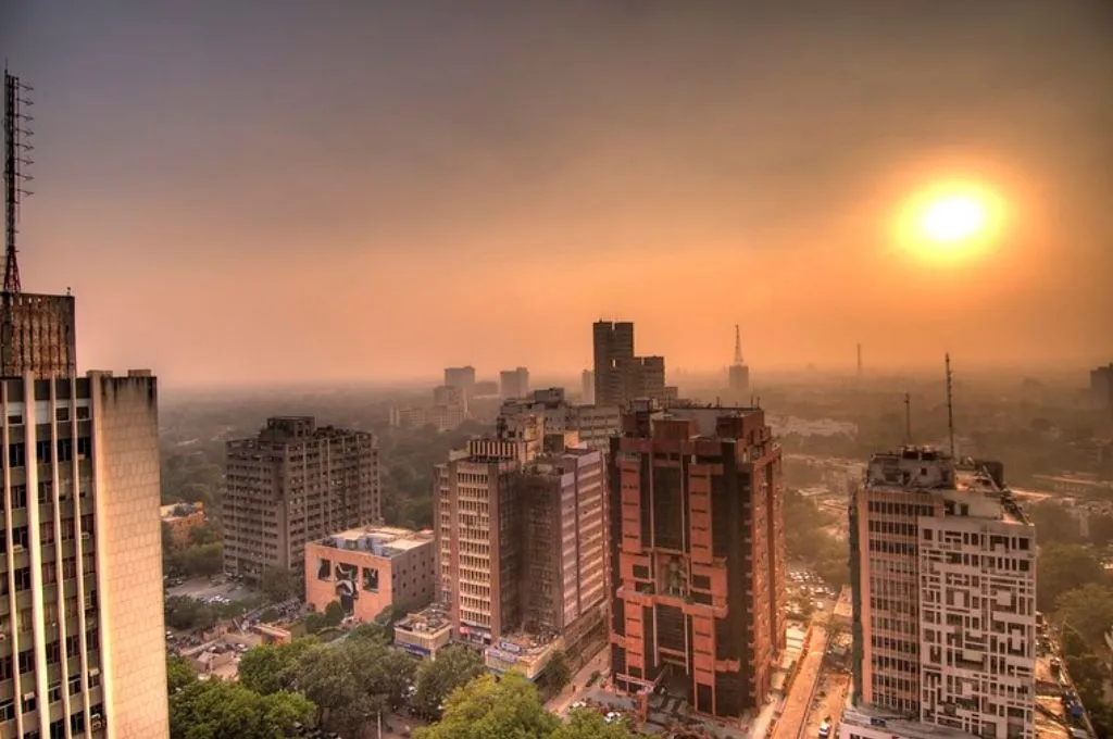 a scene of skyscrapers while the sun is setting-property