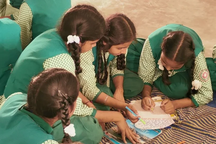 girls writing in their notebook in class--social-emotional learning