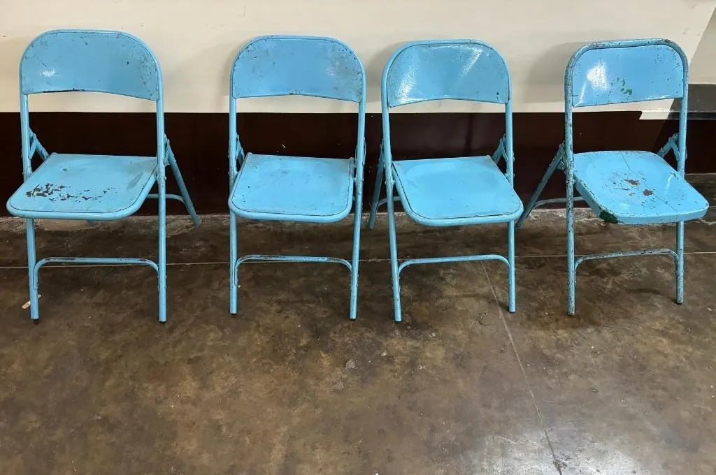 four blue chairs in a row-outcomes-based financing