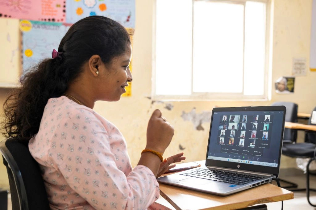 a woman using a laptop and who is on a Zoom meeting-skill training