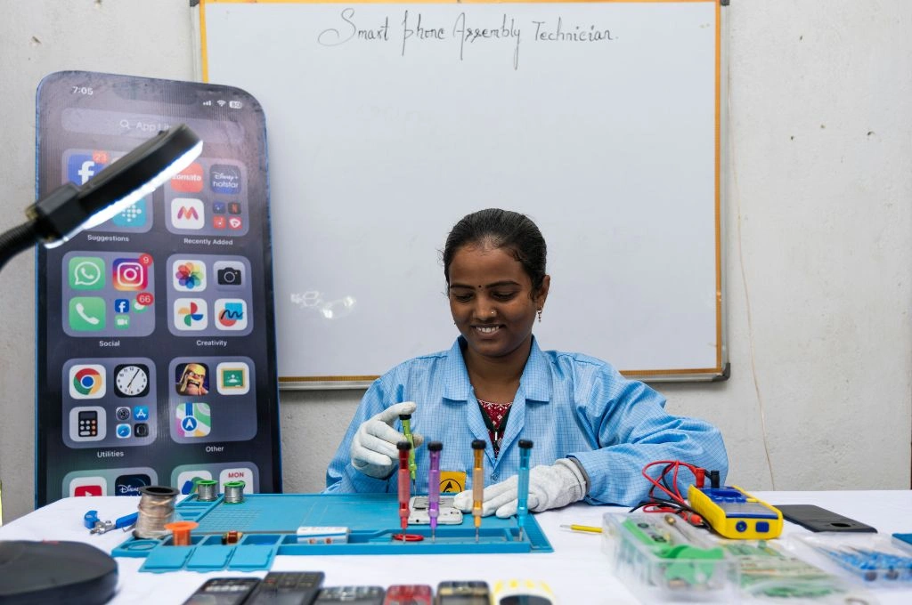 a woman working to fix a smartphone-skill training