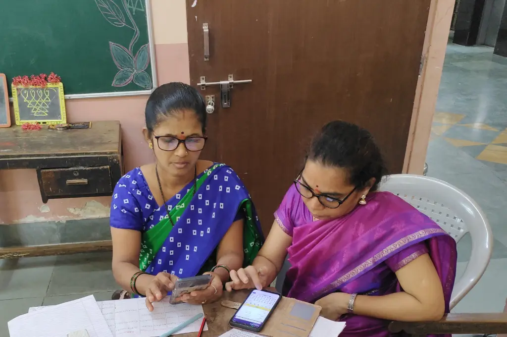 Teachers recording student data digitally_early childhood education