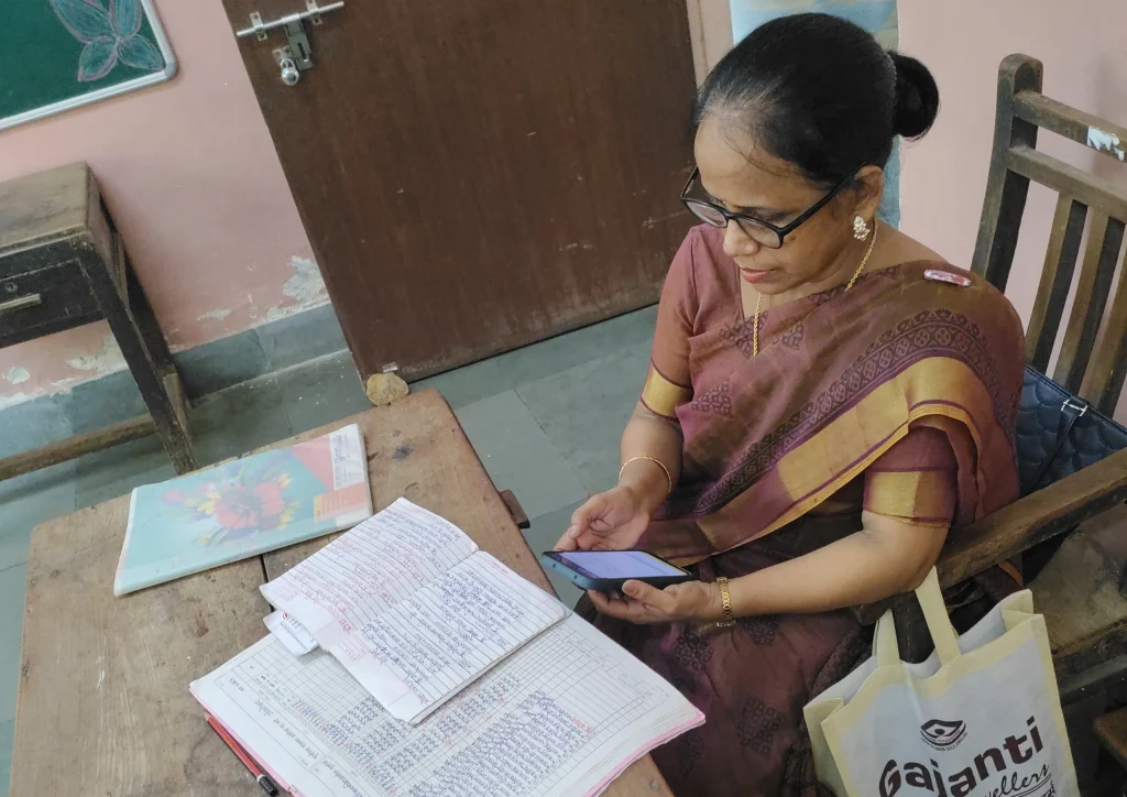 Teacher recording data on phone_early childhood education