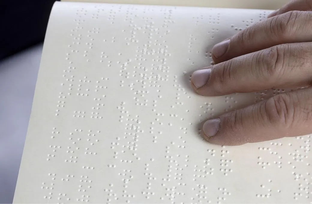 a person reading Braille_blind students