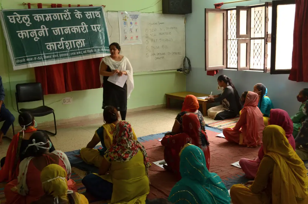 Women seated on floor during workshop_paralegal assistance