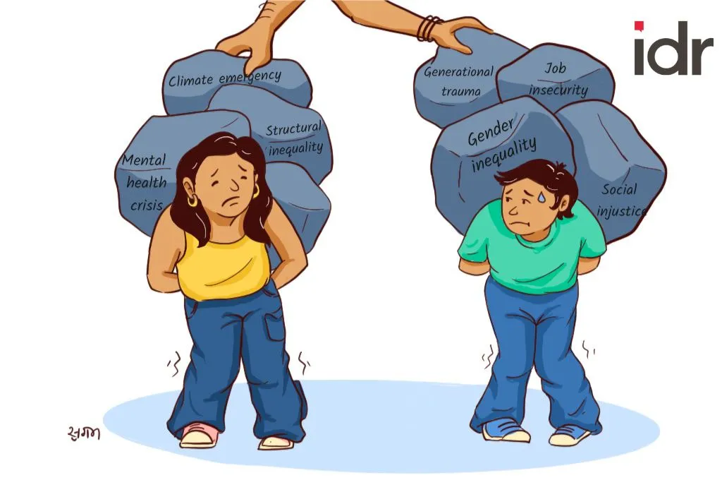 The image is an illustration of two young people straining under the weight of a pile of rocks on their backs. Written on each rock are terms including, 'climate emergency', 'mental health crisis', structural inequality', 'gender inequality', 'job insecurity', 'generational trauma', and 'social justice'. Two hands can be seen adding more rocks on to the backs of the two people._Nonprofit humour