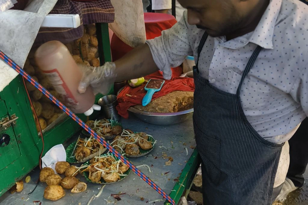 A man making panipuri in Tripura