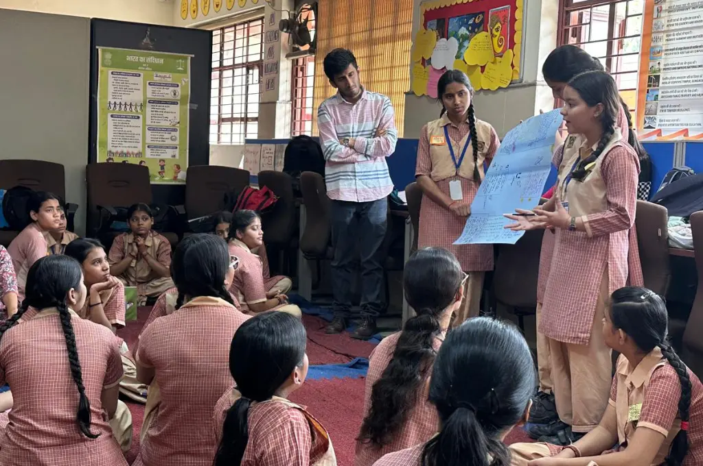 Girls presenting project during classroom session_career guidance