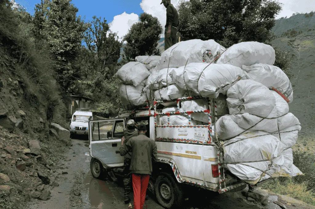 sacks of waste loaded up in a truck in the indian himalayas--waste management