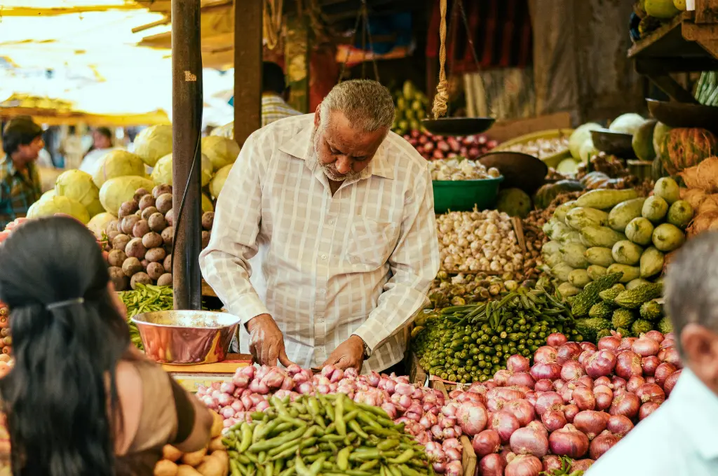 a vegetable vendor in India selling vegetables--community-driven change
